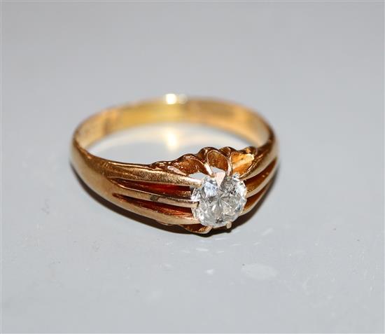 A George V 18ct gold and claw set solitaire diamond ring, size S.